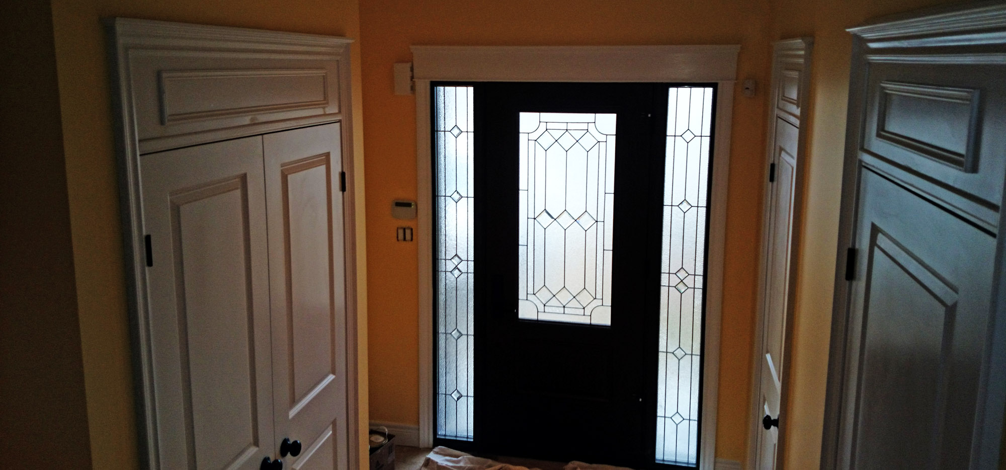 A freshly painted front entrance way in Hamilton Ontario painted by Moncast Custom Painting and Drywall
