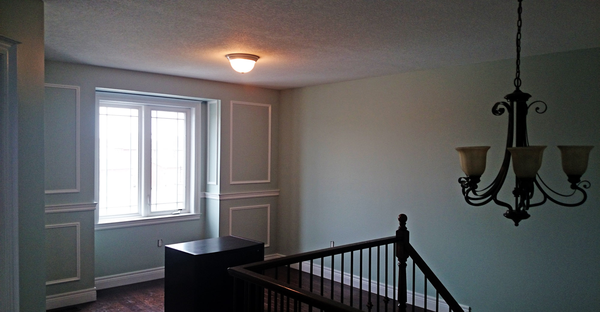 A freshly painted landing in Hamilton Ontario painted by Moncast Custom Painting and Drywall