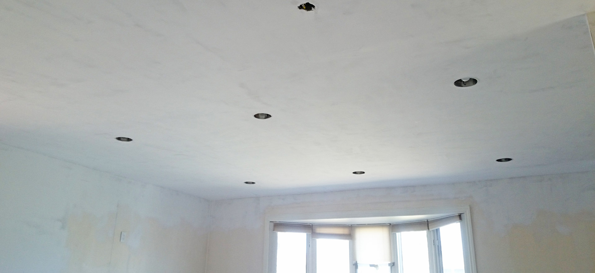 Drywal repair and restoration to this ceiling in Hamilton by Moncast