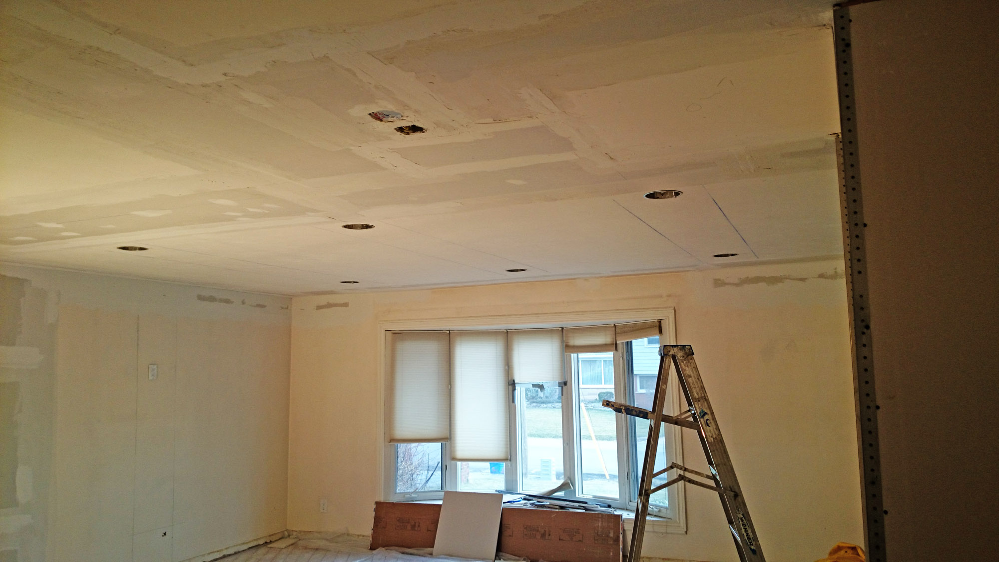 A ceiling gets new drywall as part of a restoration project in Hamilton by Moncast